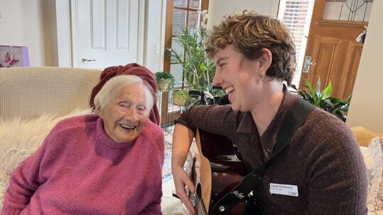Ethel Cowley and music therapist Laura Kirkwood share a laugh while singing the song they wrote for Ethel's younger self.