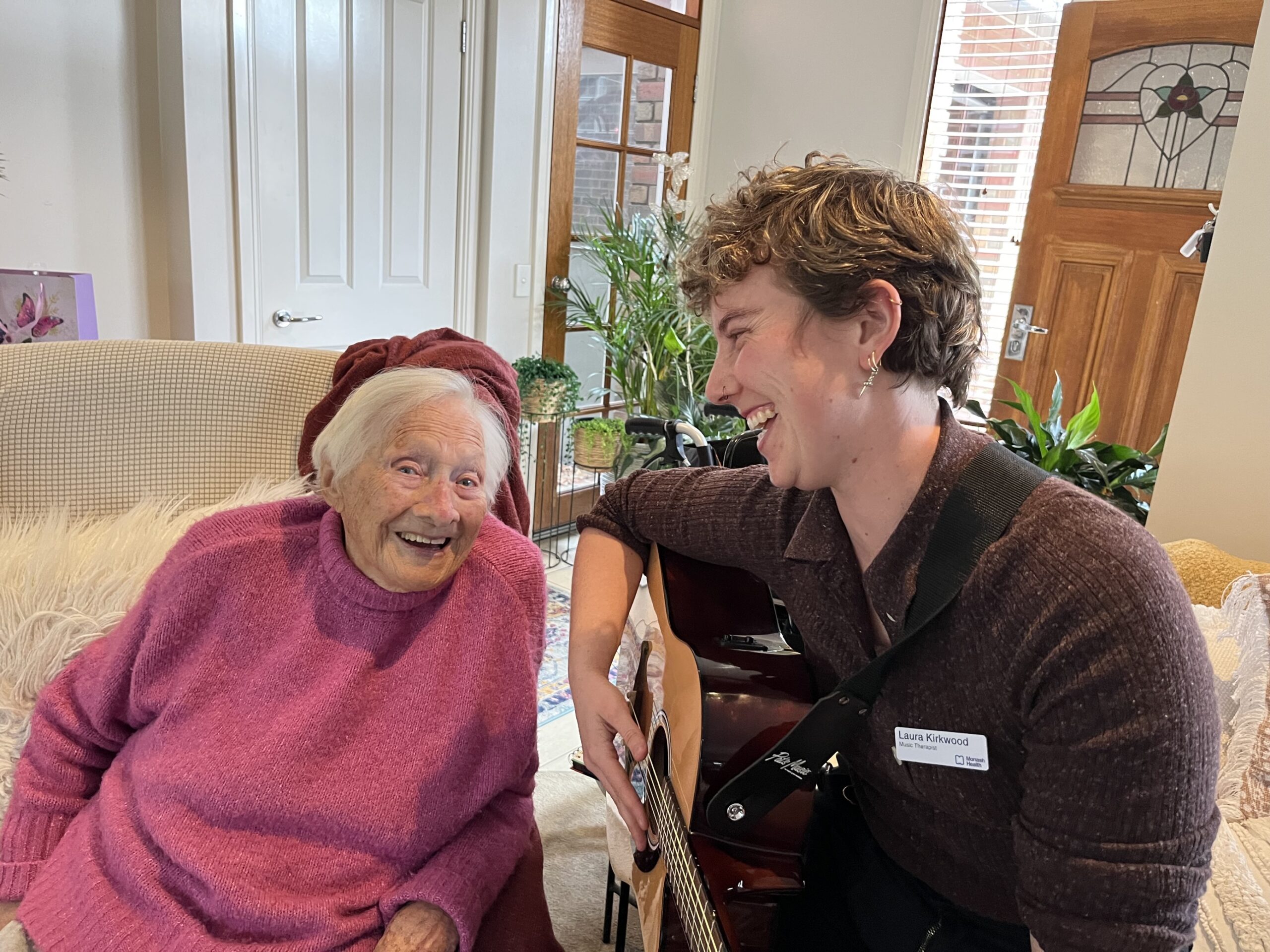 Ethel Cowley and music therapist Laura Kirkwood share a laugh while singing the song they wrote for Ethel's younger self.