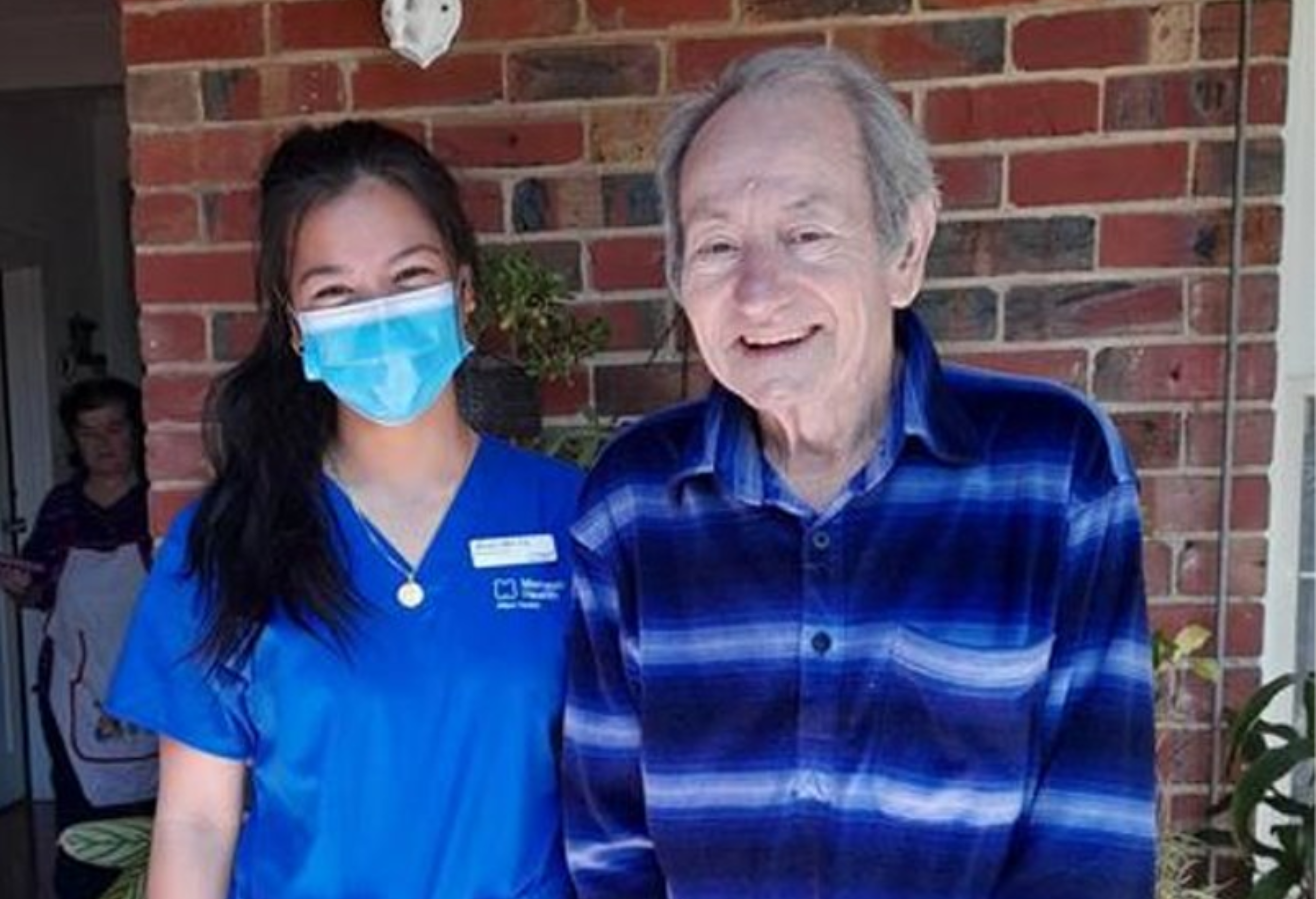A Monash at Home nurse visiting an older male patient.