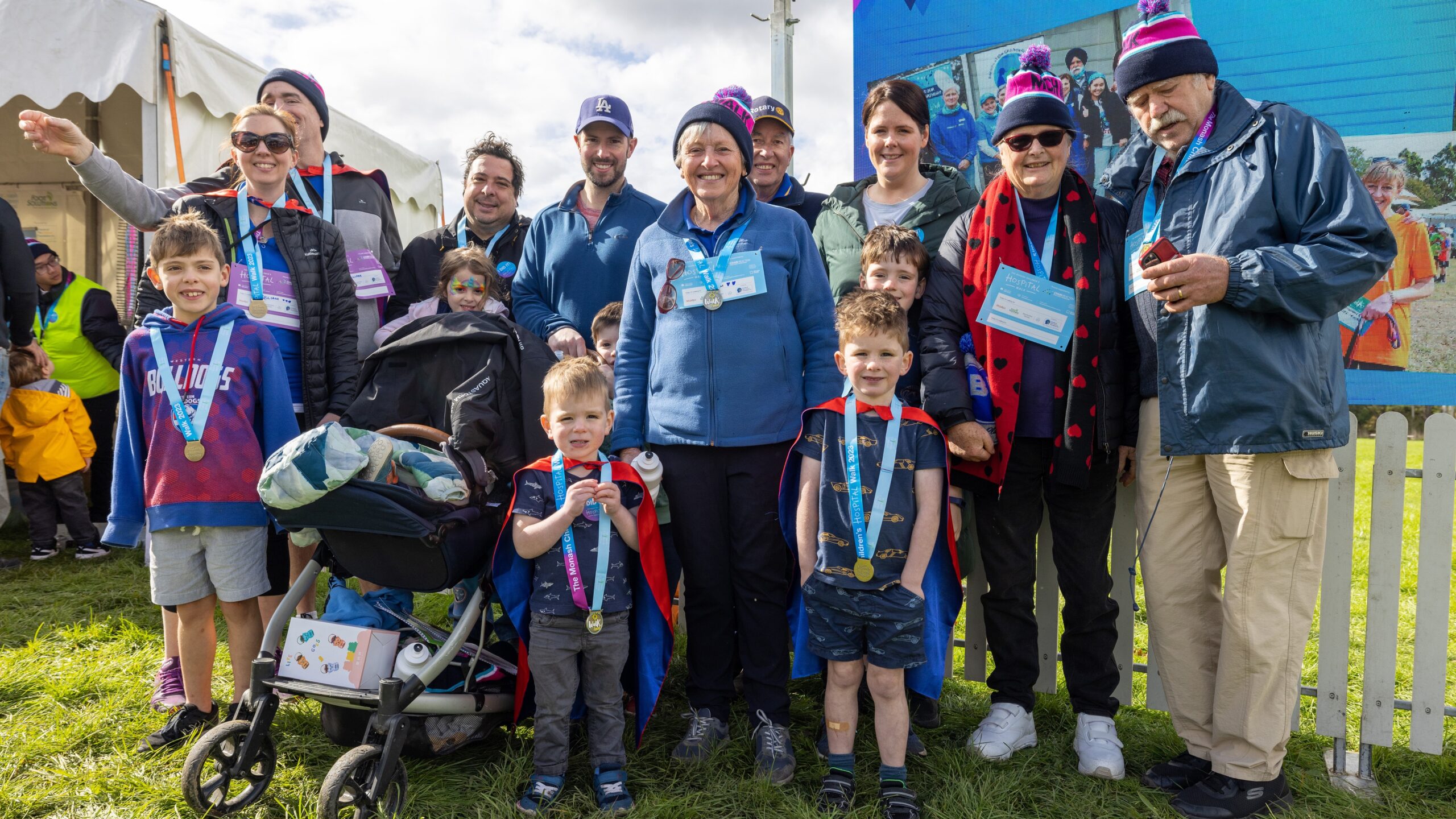 Group of 10+ people of all ages at MCH Walk