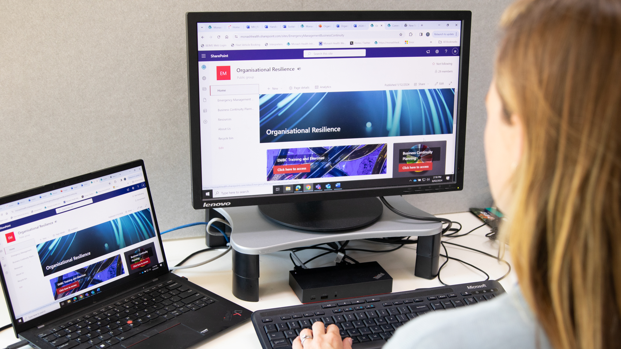 A woman browses the Organisational Resilience Sharepoint site
