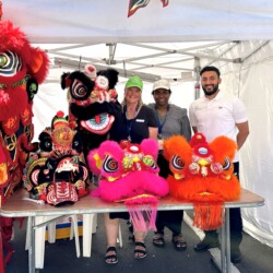 Members of the South East Public Health Unit standing beside Lion Dance heads. Members of the South East Public Health Unit standing beside Lion Dance heads.